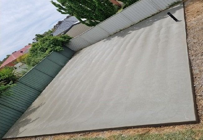 A light brown colour decent sized concrete shed slab freshly poured for a Mandurah WA homeowner.